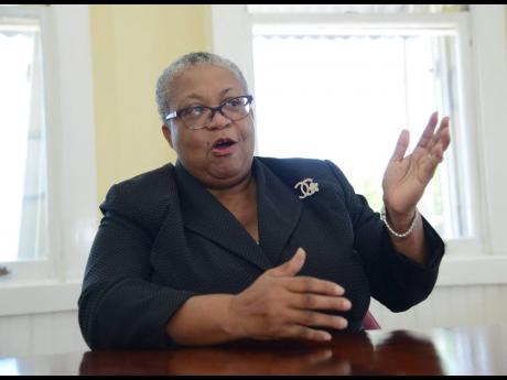 Credit: Gladstone Taylor Managing Director of Jamaica Stock Exchange Limited, Marlene Street Forrest.