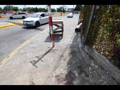 The bloodstained sidewalk where Kevin Clarke was killed.