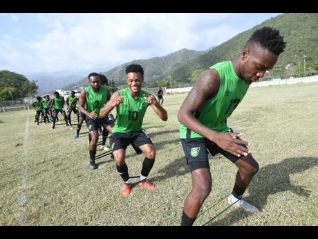 Members of Jamaica’s national senior football team go through their paces during a training session at the UWI/Jamaica Football Federation Captain Horace Burrell Centre of Excellence in August 2019.