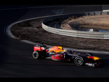 Credit: AP F1 driver Max Verstappen drives his car through one of the two banked corners during a test and official presentation of the renovated F1 track in the beachside resort of Zandvoort, western Netherlands, Wednesday, March 4, 2020. (AP Photo/Peter Dejong)