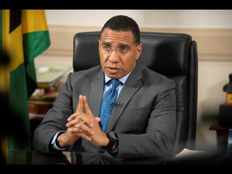 Prime Minister Andrew Holness addresses the nation at Jamaica House following the announcement of the island’s first confirmed case of 
COVID-19 on Tuesday. 