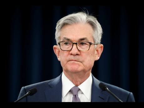 Federal Reserve Chair Jerome Powell pauses during a news conference, Tuesday, March 3, 2020, while discussing an announcement from the Federal Open Market Committee, in Washington. In a surprise move, the Federal Reserve cut its benchmark interest rate by a sizable half-percentage point in an effort to support the economy in the face of the spreading coronavirus. Chairman Jerome Powell noted that the coronavirus “poses evolving risks to economic activity.” 