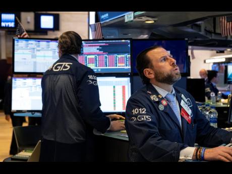 Trader Peter Tuchman works on the floor of the New York Stock Exchange Monday, March 16, 2020. 