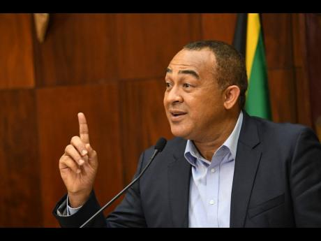 Dr Christopher Tufton, minister of health and wellness, addresses a press conference on COVID-19 at Jamaica House on Monday.