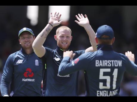 England’s Ben Stokes (centre) celebrates dismissing West Indies’ Shai Hope during the second One-Day International at Kensington Oval in Bridgetown, Barbados, on Friday, February 22, 2019. 