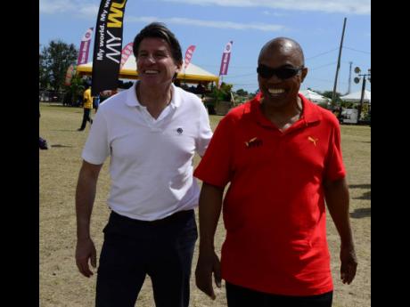 World Athletics President Sebastian Coe (left) and Dr Warren Blake, JAAA president.