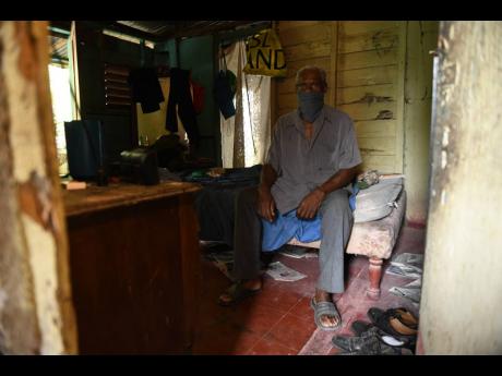 Credit: Ricardo Makyn/Chief Photographer Albert Noble, 73, sits in his house along Fort George Road in Annotto Bay, St Mary, which has been placed under quarantine after 13 COVID-19 cases emerged within days. Noble, who is among the high-risk age group, says that he does not have underlying issues and follows Gleaner and radio coronavirus updates and practises social distancing and hand sanitisation.