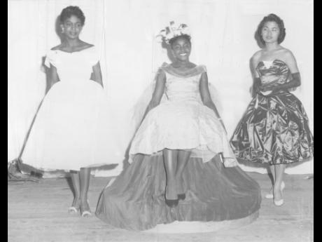 
Miss Daphne Adams (centre) wears her new crown as the University College of the West Indies (UCWI) Campus Queen 1958, at the Dramatic Theatre. At left is second-prize winner Miss Helen Scott and at right is third prizewinner, Miss Joyce Chung, also of the Faculty of Arts. 