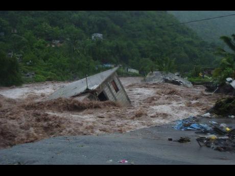 A house being washed away during Hurricane Ivan in September 2004.