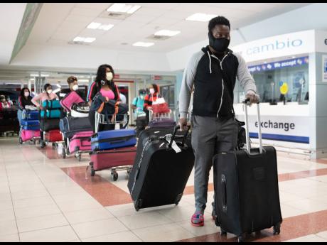 Persons returning to Jamaica after resumption of air travel. Tourism, airlines, and travel companies have been among the worst hit from the pandemic. With no real business-continuity insurance in Jamaica, they and other businsses are unlikely to recover fo