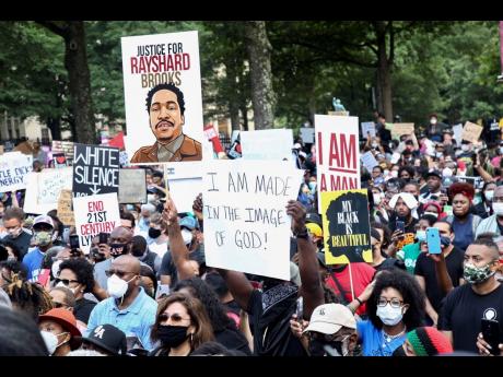 A crowd of demonstrators march to the Capitol in Atlanta, Georgia, on Monday.