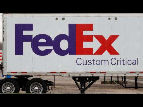Credit: AP A FedEx logo at a facility in Romulus, Michigan.