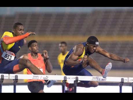 Credit: File Orlando Bennett clears a hurdle while competing in the men’s 110m hurdles at the JAAA National Senior Championships on Sunday June, 23, 2019.
