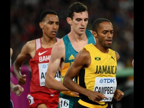 Credit: File In this file photo from August 2017, Jamaica’s Kemoy Campbell (right) takes part in heat two of the men’s 5000m race at the World Athletics Championships in London, England.