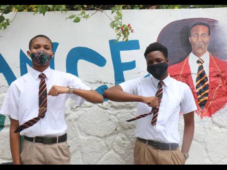Credit: Ashley Anguin Jadon Hewitt (left) and Jaheim Stennett, lower sixth form students at Cornwall College in Montego Bay.