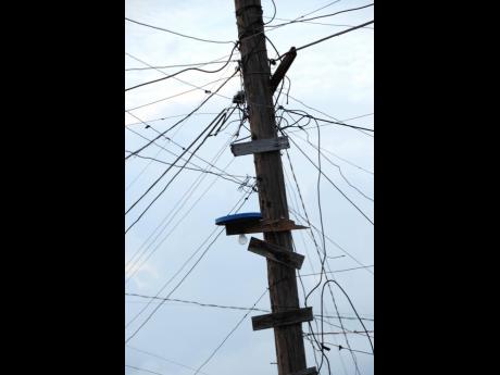In this 2010 file photo, Illegal connections to a Jamaica Public Service utility pole are seen in Majesty Gardens, St Andrew. 
