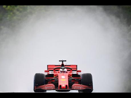 Ferrari driver Sebastian Vettel of Germany during the second practice session for the Hungarian Formula One Grand Prix at the Hungaroring racetrack in Mogyorod, Hungary, yesterday.Ferrari driver Sebastian Vettel of Germany during the second practice sessio