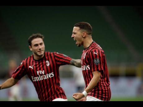 AP
AC Milan’s Ismael Bennacer (right) celebrates after scoring during a Serie A match between AC Milan and Bologna, at the San Siro stadium in Milan, Italy, yesterday. Milan won 5-0.