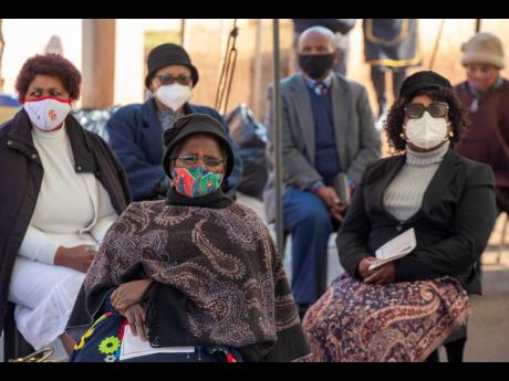 Yesterday, mourners attend the funeral of Nurse Duduzile Margaret Mbonane who died from COVID-19 in Thokoza, east of Johannesburg. 