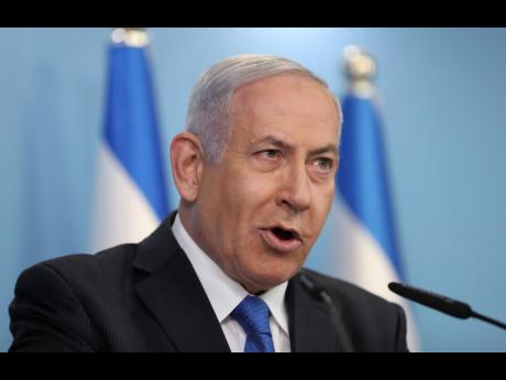 Credit: AP Israeli Prime Minister Benjamin Netanyahu announces that full diplomatic ties will be established with the United Arab Emirates, during a news conference in Jerusalem yesterday.