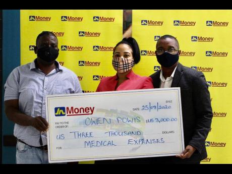 Owen Powis (left) accepts a donation from Horace Hines (right), general manager, JN Money Services, and Melissa Draggon, operations supervisor at JN Money Services, owners and operators of the JN Money brand, to assist with his medical treatment. Powis was
