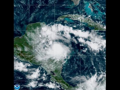 This satellite image released by the National Oceanic and Atmospheric Administration shows Tropical Storm Nana approaching Belize on Wednesday. 