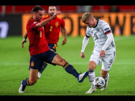 Credit: AP Germany’s Timo Werner (right) and Spain’s Fabian Ruiz battle for the ball during their UEFA Nations League football match at the Mercedes-Benz Arena stadium in Stuttgart, Germany, yesterday. The game ended in a 1-1 draw.