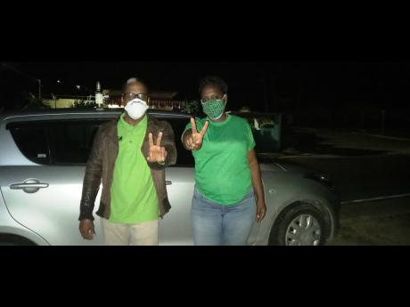Credit: Gareth Dawis Norman Dunn poses with a supporter shortly after winning the South East St Mary seat last Thursday.