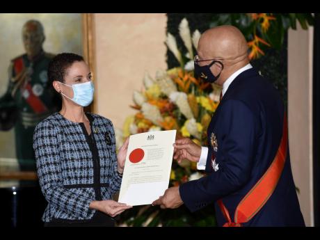 As the prime minister names the new members of his Cabinet, he should return to appointing two ministers in the Ministry of Foreign Affairs and Foreign Trade. Here, Foreign Affairs Minister Kamina Johnson Smith is presented with the instrument of appointme