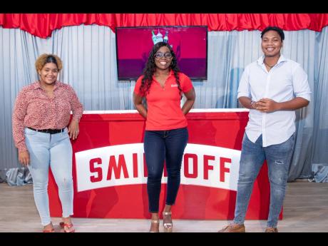 Credit: Contributed Smirnoff Brand Manager Reshima Kelly is sandwiched by UWI Marketing Association Vice- Presidents Sheyeen Leslie (left) and Alrique Welsh.
