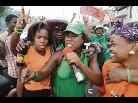 In this 2016 file photo People’s National Party and Jamaica Labour Party supporters are at West and Beeston Street in West Kingston on Nomination Day.
