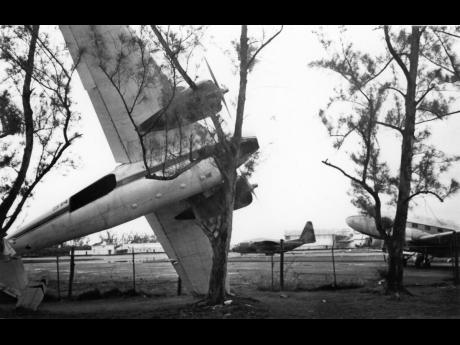 
This twin-engine Cessna aircraft ended up between the willows on the road leading into the Norman Manley International Airport in Kingston after being blown off the tarmac by Hurricane Gilbert.