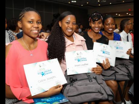 From left: Celine Josephs, Imani Lauther, Karissa Lawrence and Gabrielle Jones, 2018 Sagicor Foundation tertiary scholarship awardees, pause for a photo at the 2018 Sagicor Foundation Scholarship Awards Ceremony, held at The Jamaica Pegasus hotel, New King