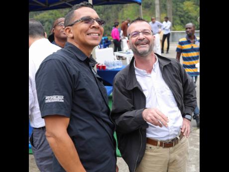 In this photo taken in May 2019, Managing Director of Stoneleigh Coffee Roasters Limited David Shirley (left) is seen with Nestlé Jamaica Country Manager Daniel Caron.