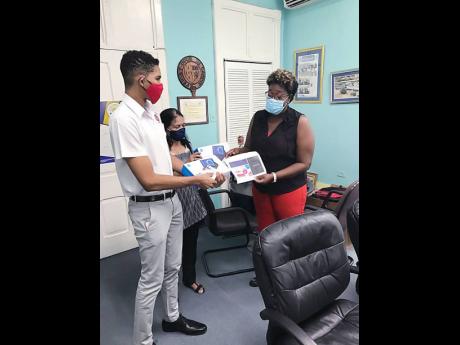 Credit: Contributed The handover to Jamaica College is made by Murray (left), and Dr Sudha Shah of the SAKHI Indian Women’s Group in Jamaica to Deborah Walcott, dean of student affairs.