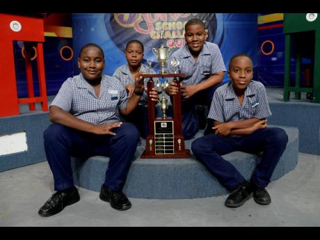 Credit: Shorn Hector/Photographer The boys from Mona Prep pose with the trophy for winning TVJ’s Junior Schools’ Challenge Quiz for 2019. They won over Broughton Primary. Team members in photo are (from left) Damajae McCalla, Jonathan Whyte, Mijaun Talbot, and Gabriel McDaniel.