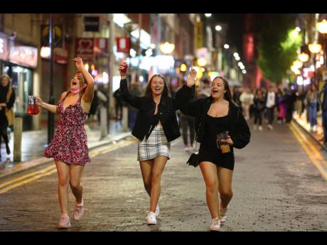 People are out socialising in Liverpool’s city centre ahead of the 10 p.m. curfew that pubs and restaurants are subject to, in order to combat the rise in coronavirus cases in England, on Saturday, October 10.