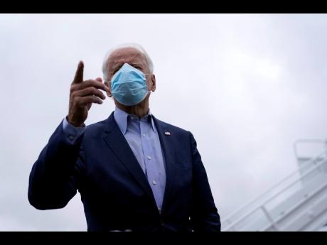 Credit: AP Democratic presidential candidate former Vice-President Joe Biden speaks to members of the media before boarding his campaign plane at New Castle Airport, in New Castle, Delaware, on Monday.