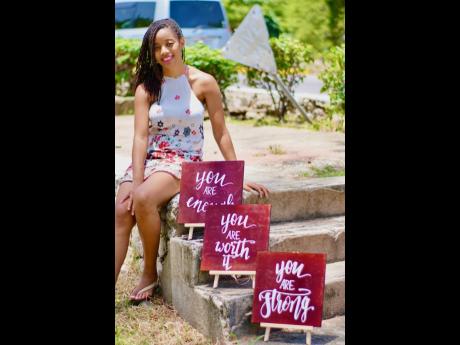 Kadene Gray shows off some of her pieces.