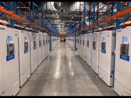 This handout photo taken in October 2020 and provided by Pfizer shows part of a ‘freezer farm’, a football field-sized facility for storing finished COVID-19 vaccines, in Puurs, Belgium.