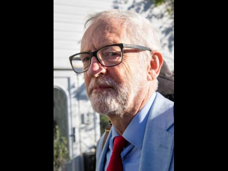 Britain's former opposition Labour Party leader Jeremy Corbyn leaves his home in London, Wednesday Nov 18, 2020.  Corbyn will be reinstated into the political party, it is announced Wednesday, after a three-week suspension as Labour’s National Executive 
