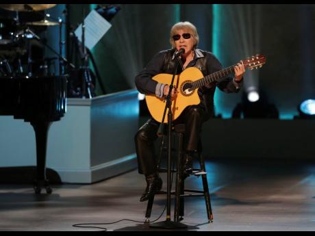 Credit: AP Musician Jose Feliciano is celebrating 50 years of his bilingual Christmas classic 'Feliz Navidad' by releasing a new version featuring Jason Mraz, Lin-Manuel Miranda, Shaggy and more.