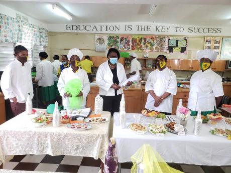  Jaqueline Scott (centre), teacher at Alston High School, engages her students in a home economics class.