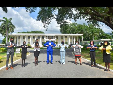 Prime Minister Andrew Holness (fourth left) and Permanent Secretary in the Office of the Prime Minister Audrey Sewell (fourth right) interact with six of the seven persons selected as the second cohort for the Jamaica House Fellowship Programme, during the