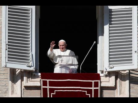 Credit: AP Pope Francis waves as he arrives for the Angelus noon prayer from the window of his studio overlooking St Peter’s Square at the Vatican on Sunday.
