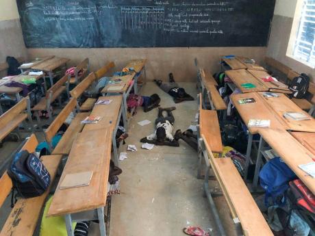 Children practice security drills at school in the village of Dori, Burkina Faso, on Tuesday, October 20, 2020.