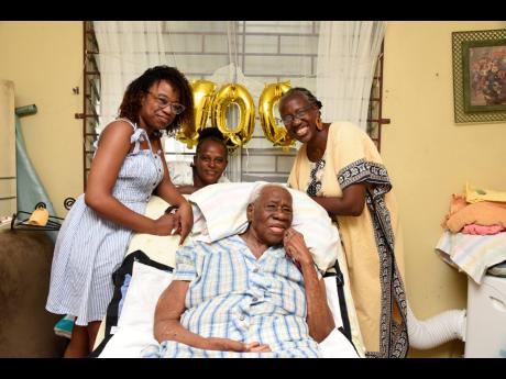 From left: Twyla Allen, Kay-Marie Murray, centenarian Olive Dixon, and Carolyn Allen.