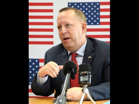 Deputy Chief of Mission John McIntyre addresses journalists at the United States Embassy on Monday. 