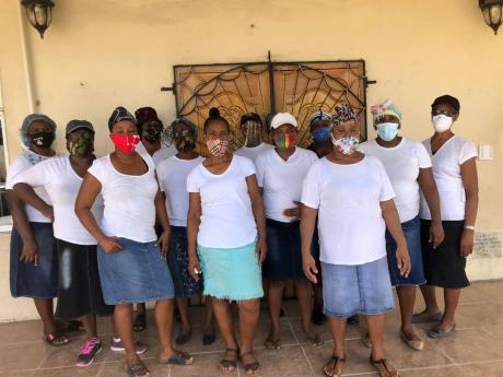 Credit: Photo by Cecelia Campbell-Livingston Members of the outreach team from the Women’s Ministry of the Church of Our Lord Jesus Christ of the Apostolic Faith (Refuge Temple) ready to carry out their mission.