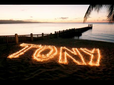 Tony Hart’s name written in the sand on the beach at Doctor’s Cave. 